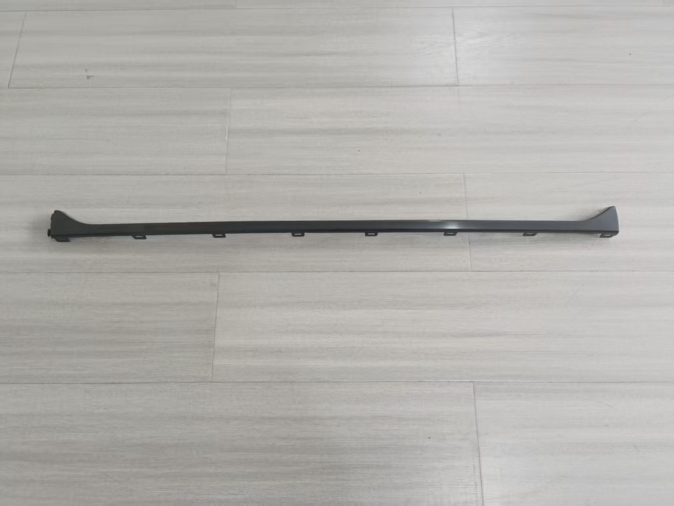 Bright stripe surface in the middle of rear bumper